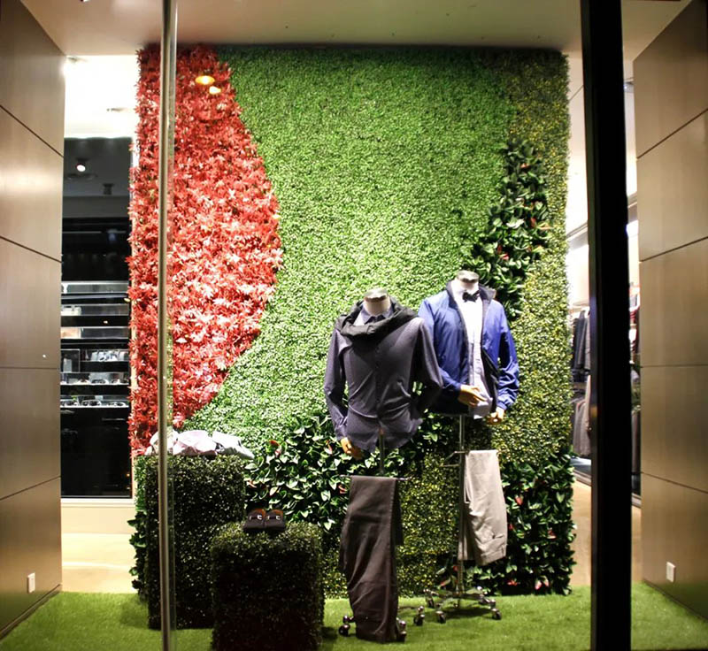 fake greenery wall at clothing store
