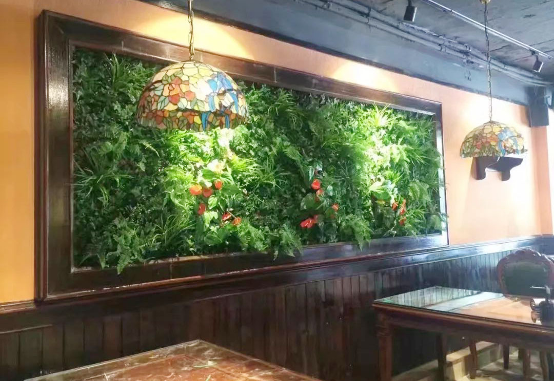 restaurant with faux green wall